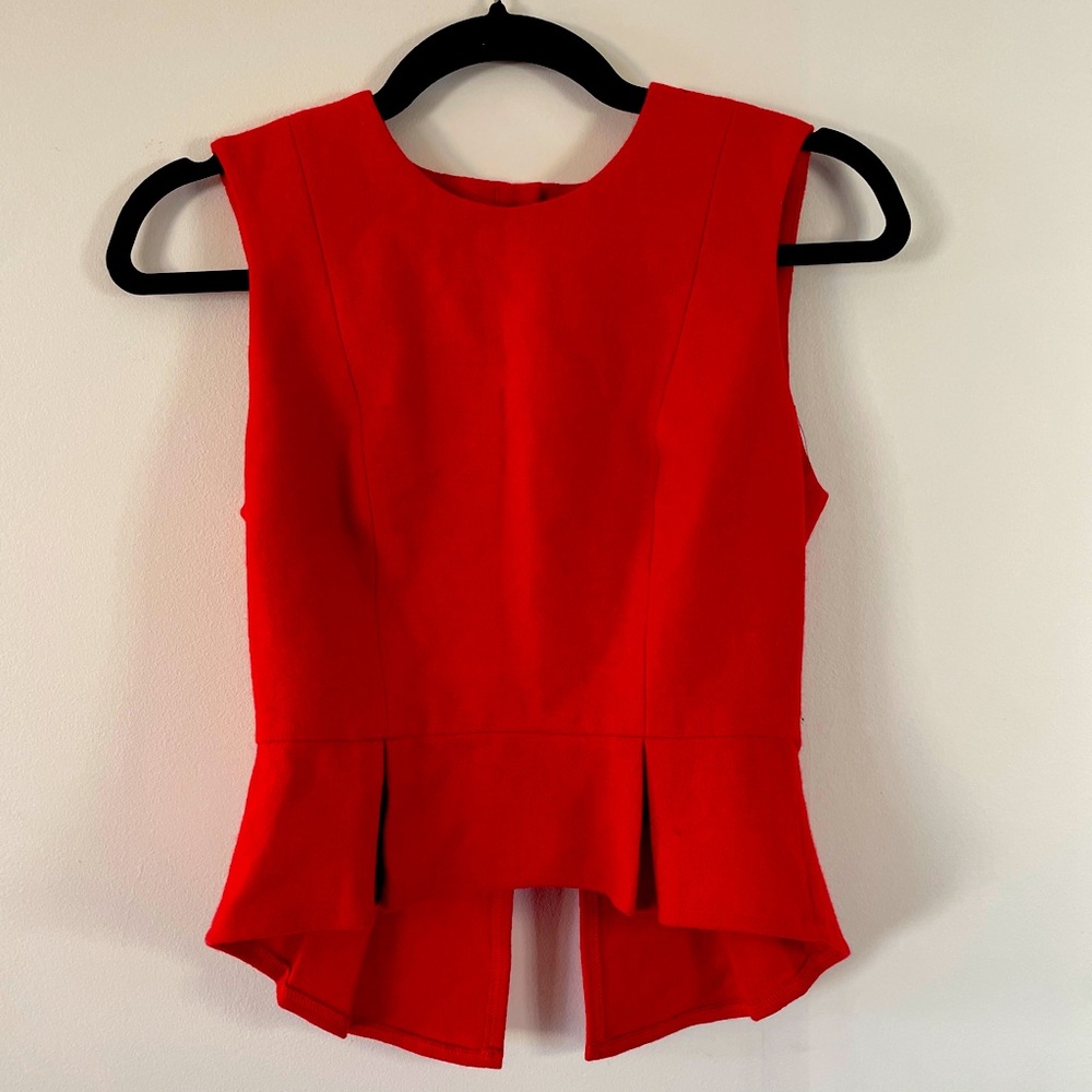 In god we trust orange peplum top sz XS